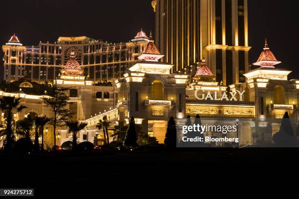 The Galaxy Macau casino and hotel, developed by Galaxy Entertainment Group Ltd., stands illuminated at night in Macau, China, on Saturday, Feb. 24,...