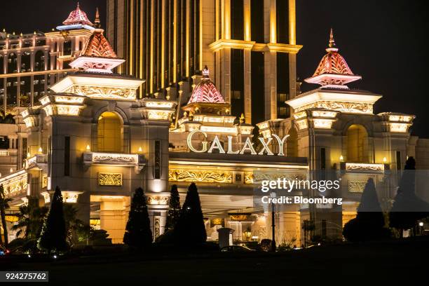 The Galaxy Macau casino and hotel, developed by Galaxy Entertainment Group Ltd., stands illuminated at night in Macau, China, on Saturday, Feb. 24,...