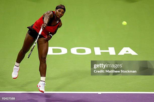 Serena Williams of the United States serves to Venus Williams of the United States in round robin play during the Sony Ericsson WTA Championships at...