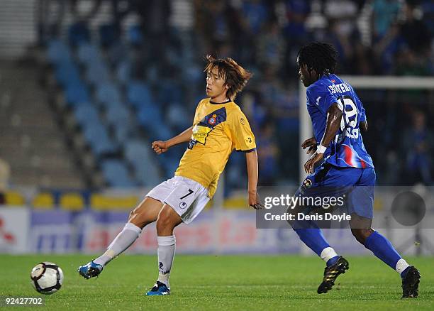Shunsuke Nakamura of RCD Espanyol passes the ball beside Derek Boateng of Getafe during the Copa del Rey first round, first leg match at Coliseum...