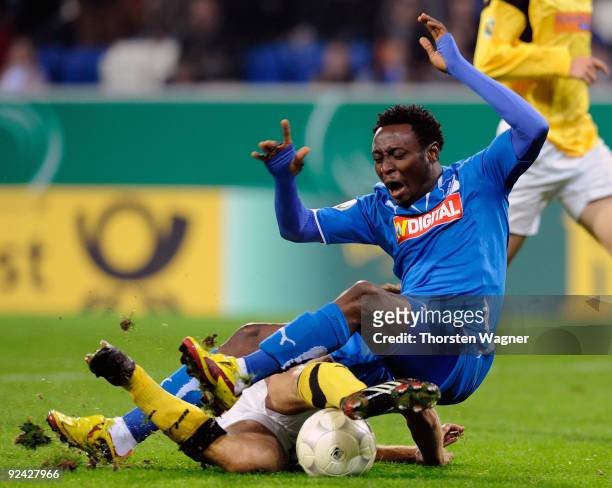 Chinedu Obasi of Hoffenheim battles for the ball with Benjamin Lense of Koblenz during the DFB Cup round of 16 match between TSG 1899 Hoffenheim and...