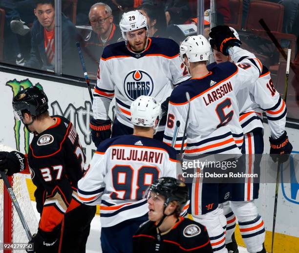 Leon Draisaitl, Ryan Strome, Adam Larsson, and Jesse Puljujarvi of the Edmonton Oilers celebrate Strome's second period goal against Nick Ritchie and...