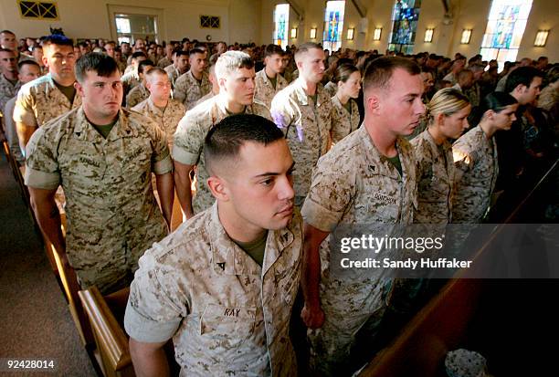 Marines pay their respects during a memorial service for Staff Sgt. Aaron J. Taylor in the Chapel at Camp Pendleton on October 28, 2009 in Oceanside,...