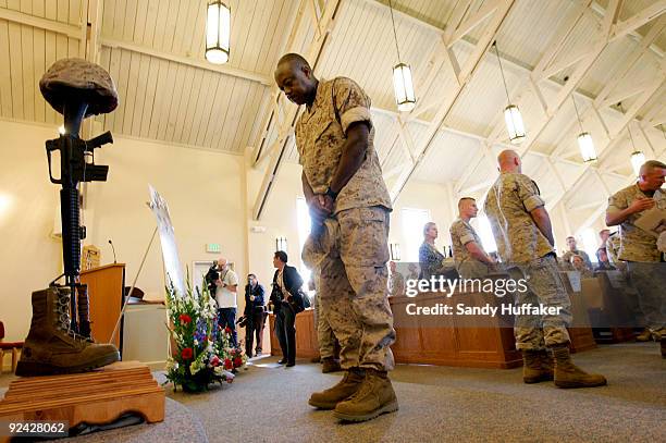 Marines pay their respects during a memorial service for Staff Sgt. Aaron J. Taylor in the Chapel at Camp Pendleton on October 28, 2009 in Oceanside,...