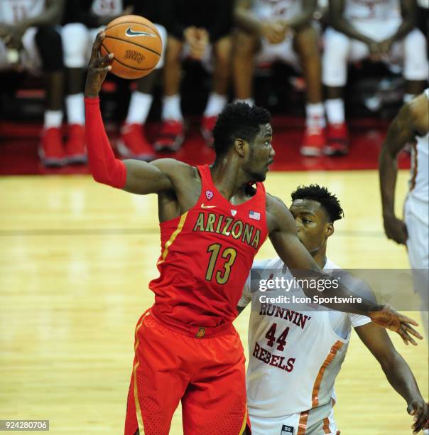 Arizona Wildcats forward Deandre Ayton collects a rebound in front of UNLV Runnin Rebels forward Brandon McCoy during their game at the Thomas & Mack...