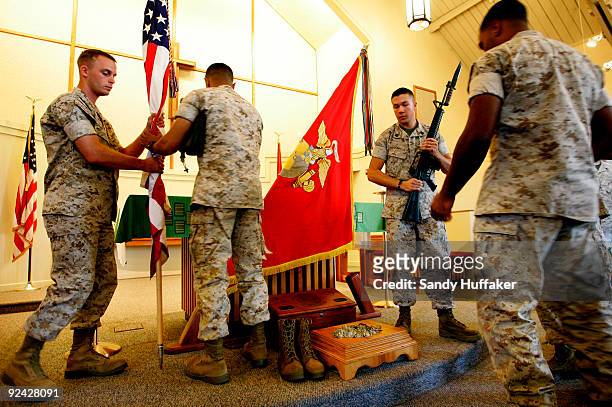 Marines break down podium area following the memorial service for Staff Sgt. Aaron J. Taylor in the Chapel at Camp Pendleton on October 28, 2009 in...