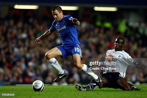 Joe Cole of Chelsea battles for the ball with Fabrice Muamba of Bolton Wanderersduring the Carling Cup 4th Round match between Chelsea and Bolton...