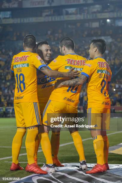 Andre-Pierre Gignac of Tigres celebrates with teammates after scoring his team's first goal during the 9th round match between Tigres UANL and...