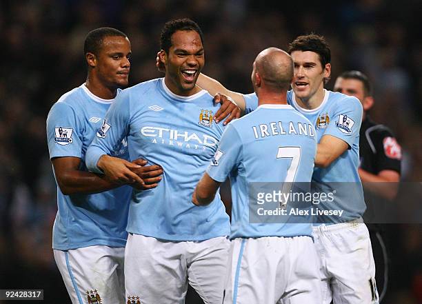 Joleon Lescott of Manchester City celebrates with Stephen Ireland after scoring his goal during the Carling Cup 4th Round match between Manchester...