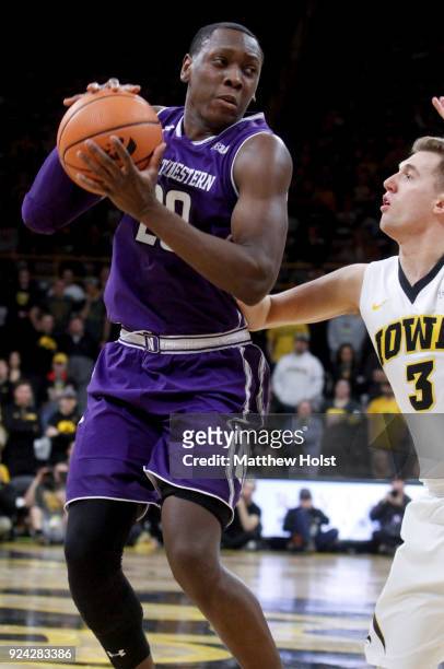 Guard Scottie Lindsey of the Northwestern Wildcatsgoes to the basket in the first half against guard Jordan Bohannon of the Iowa Hawkeyes, on...