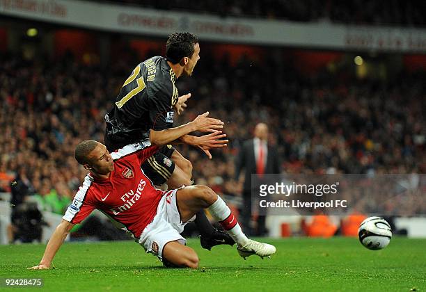 Philipp Degen of Liverpool competes with Kieran Gibbs of Arsenal during the match between LiverpooL FC and Arsenal during the Carling Cup Fourth...