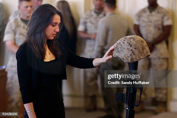 Stephanie Jacobs pays her respects to her fiancee, Staff Sgt Aaron J. Taylor during a memorial service in the Chapel at Camp Pendleton on October 28,...