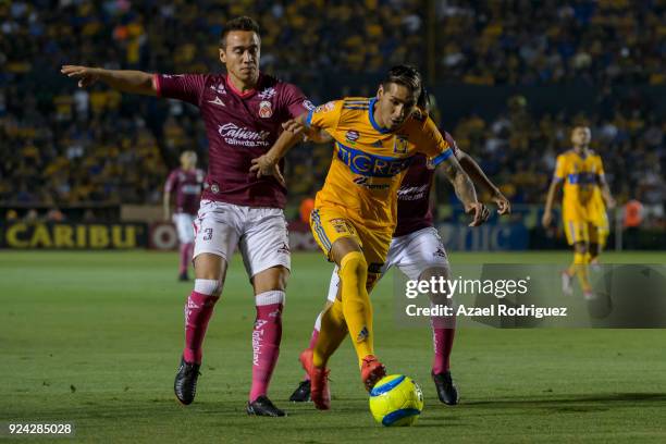 Ismael Sosa of Tigres fights for the ball with Gerardo Rodriguez and Aldo Rocha of Morelia during the 9th round match between Tigres UANL and Morelia...