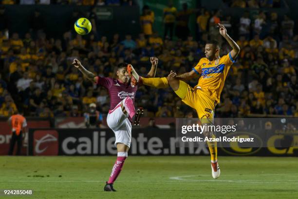 Rafael De Souza of Tigres fights for the ball with Raul Ruidiaz of Morelia during the 9th round match between Tigres UANL and Morelia as part of the...