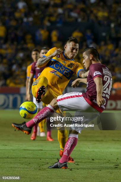 Eduardo Vargas of Tigres fights for the ball with Aldo Rocha of Morelia during the 9th round match between Tigres UANL and Morelia as part of the...