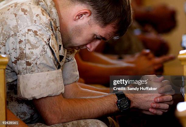 Marines pay their respects during a memorial service for Staff Sgt. Aaron J. Taylor in the Chapel at Camp Pendleton on October 28, 2009 in Oceanside,...