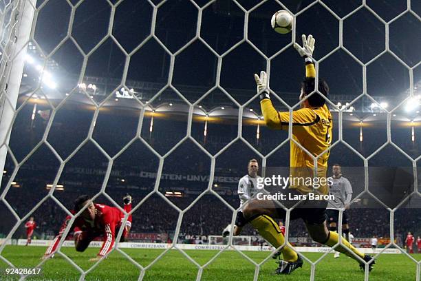 Luca Toni of Muenchen heads his team's fourth goal during the DFB Cup round of 16 match between Eintracht Frankfurt and FC Bayern Muenchen on October...