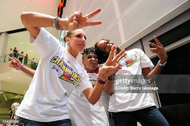 Diana Taurasi, Cappie Pondexter, and Tangela Smith of the Phoenix Mercury pose for a picture during the WNBA Championship Rally at US Airways Center...