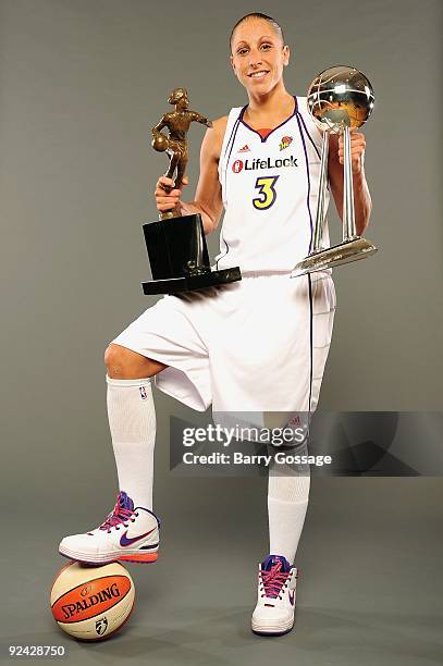 Diana Taurasi of the Phoenix Mercury poses with the WNBA Most Valuable Player and Championship Trophy during the rally at US Airways Center on...