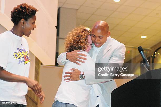 Head Coach Corey Gaines hugs Assistant Coaches Julie Hairgrove of the Phoenix during the WNBA Championship Rally at US Airways Center on October 12,...