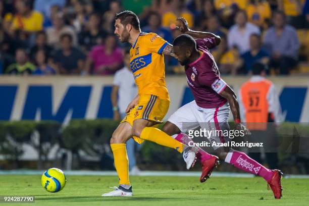 Andre-Pierre Gignac of Tigres fights for the ball with Gabriel Achilier of Morelia during the 9th round match between Tigres UANL and Morelia as part...