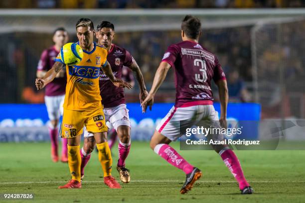 Ismael Sosa of Tigres fights for the ball with Gerardo Rodriguez of Morelia during the 9th round match between Tigres UANL and Morelia as part of the...