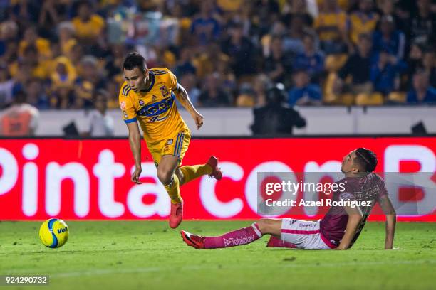 Lucas Zelarayan of Tigres fights for the ball with Diego Valdes of Morelia during the 9th round match between Tigres UANL and Morelia as part of the...