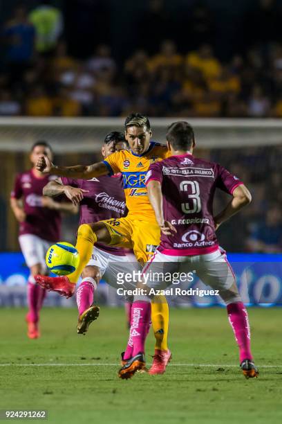 Ismael Sosa of Tigres fights for the ball with Gerardo Rodriguez of Morelia during the 9th round match between Tigres UANL and Morelia as part of the...