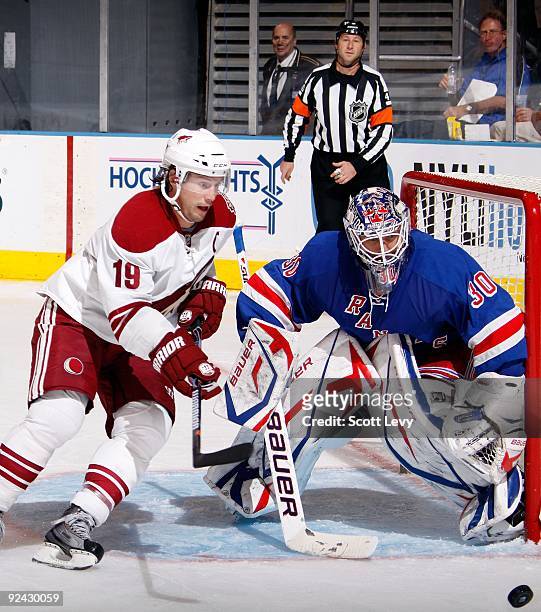 Goaltender Henrik Lundqvist of the New York Rangers protects the net against Shane Doan of the Phoenix Coyotes on October 26, 2009 at Madison Square...