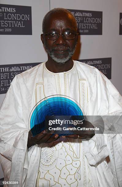 Souleymane Cisse poses with his BFI Fellowship during the Times BFI 53rd London Film Festival Awards Ceremony at Inner Temple on October 28, 2009 in...