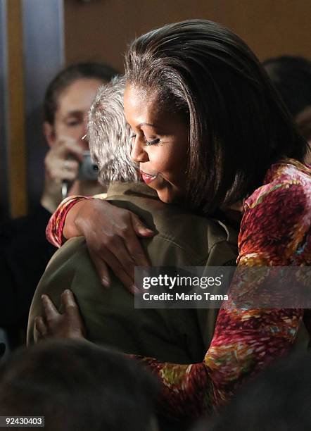 First lady Michelle Obama hugs a veteran at the James J. Peters Veterans Administration Medical Center October 28, 2009 in the Bronx borough of New...