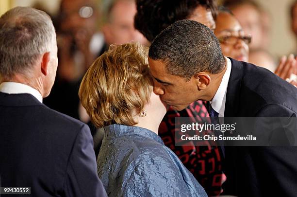 President Barack Obama kisses Judy Shepard, Matthew Shepard's mother, after delivering remarks following the enactment of the Matthew Shepard and...