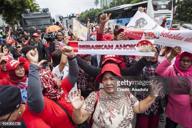 Supporters of former Jakarta Governor Basuki Ahok Tjahaja Purnama shout slogans outside the court during judicial review for blasphemy conviction in...