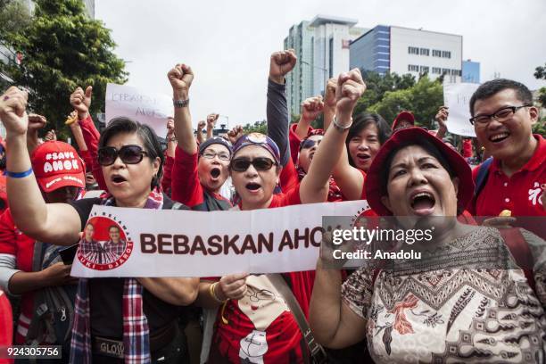 Supporters of former Jakarta Governor Basuki Ahok Tjahaja Purnama shout slogans outside the court during judicial review for blasphemy conviction in...