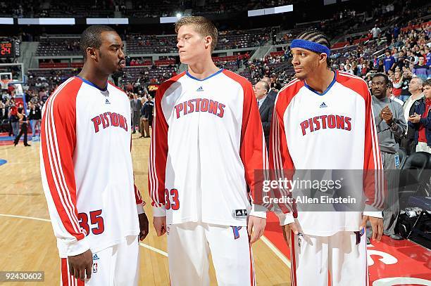 DaJuan Summers, Jonas Jerebko and Deron Washington of the Detroit Pistons stand together before the preseason game against the Minnesota Timberwolves...