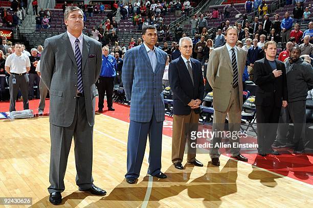 Assistant coaches Bill Laimbeer, Reggie Theus and Dave Wohl, head coach Kurt Rambis and trainer Gregg Farnam of the Minnesota Timberwolves stand on...