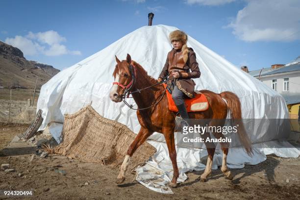 Man rides a horse near a pavilion put up by Kyrgyz brothers Kenan and Ahmet Aytac emigrated from Afghanistan's Pamir plateau 36 years ago and settled...