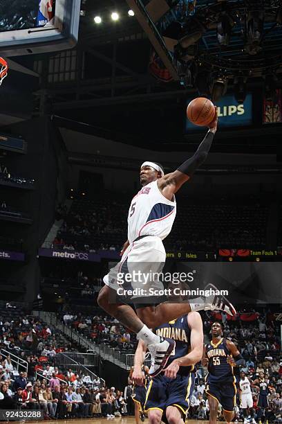 Josh Smith of the Atlanta Hawks goes for a dunk against the Indiana Pacers on October 28, 2009 at Philips Arena in Atlanta, Georgia. NOTE TO USER:...