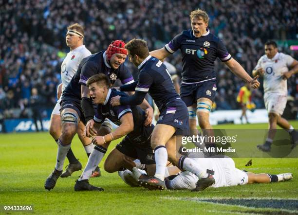 Scotland's Huw Jones is mobbed by teammates after scoring his side's opening try during the 6 Nations clash between Scotland and England at BT...