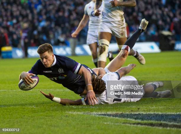 Scotland's Huw Jones dives over the line to score his side's 2nd try during the 6 Nations clash between Scotland and England at BT Murrayfield on...