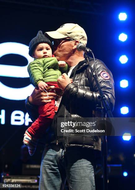 Actor Michael Keaton holds his grandson River Keaton onstage during the One 805 Kick Ash Bash benefiting First Responders at Bella Vista Ranch & Polo...