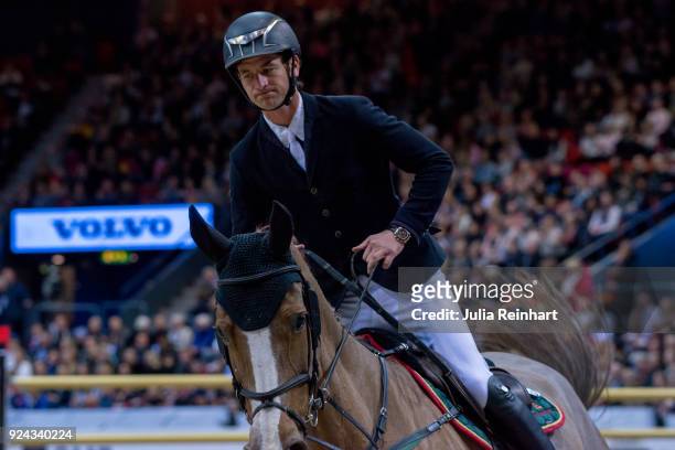 Swiss equestrian Steve Guerdat on Albfuehren's Happiness rides in the Accumulator Show Jumping Competition during the Gothenburg Horse Show in...