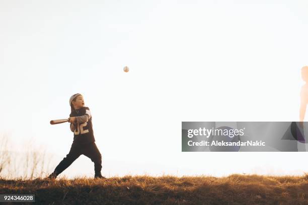 learning to swing a bat - baseball bat swing stock pictures, royalty-free photos & images