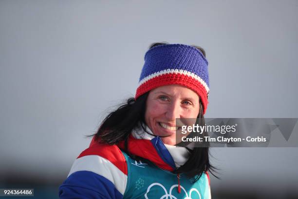 Gold medal winner Marit Bjoergen of Norway on the podium during presentations of the Cross-Country Skiing - Ladies' 30km Mass Start Classic during...