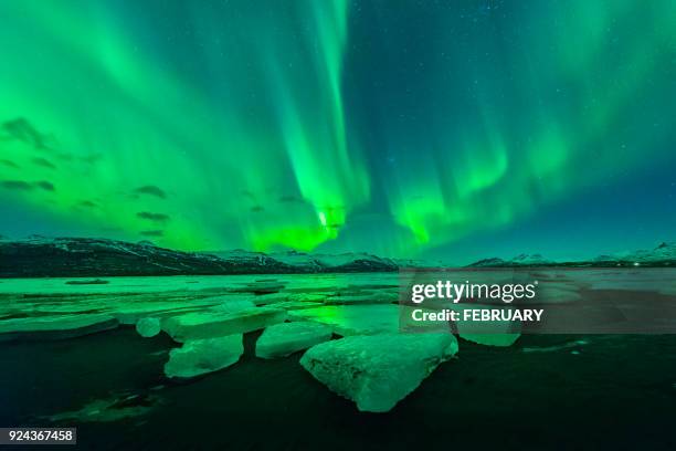 aurora above big glacier at iceland - jokulsarlon lagoon ストックフォトと画像