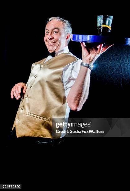 fun portraits - senior man carrying tray of glasses - sasha fox stock pictures, royalty-free photos & images