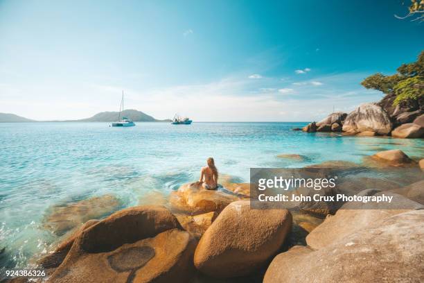 queensland beach girl - idyllic beach stock pictures, royalty-free photos & images