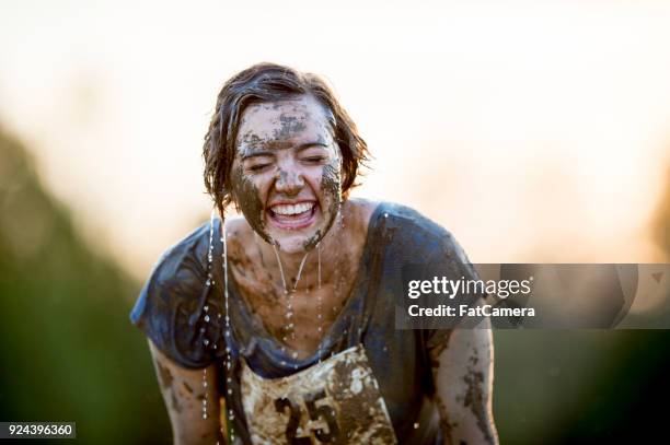 cleaning off with water - mud run stock pictures, royalty-free photos & images