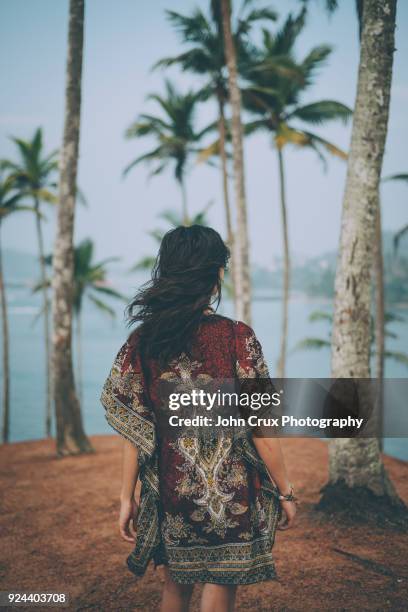 palm tree backpacker girl portraits - southern crux foto e immagini stock