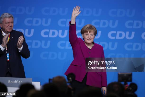 German Chancellor and Chairwoman of the German Christian Democrats Angela Merkel waves to delegates after she spoke at the 30th CDU party congress on...